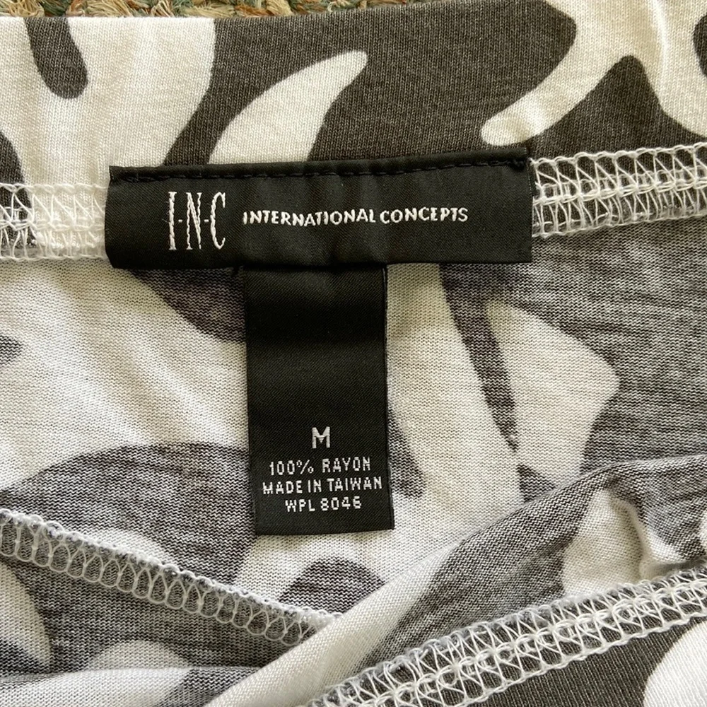 INC a line calf length skirt. Dark gray and white print and 100% rayon - Picture 2 of 3